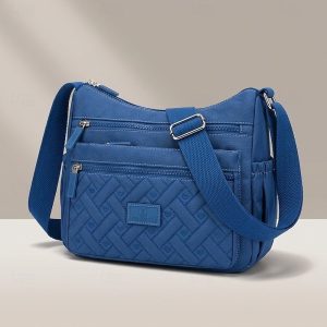 női több zsebes nylon crossbody táska – könnyű vízálló válltáska utazáshoz, munkához és mindennapi használatra — Kék